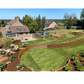 Moderne tuin met ronde keerwand in cortenstaal